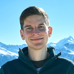 Picture of Konstantin Tieber with icy mountain peaks in the background